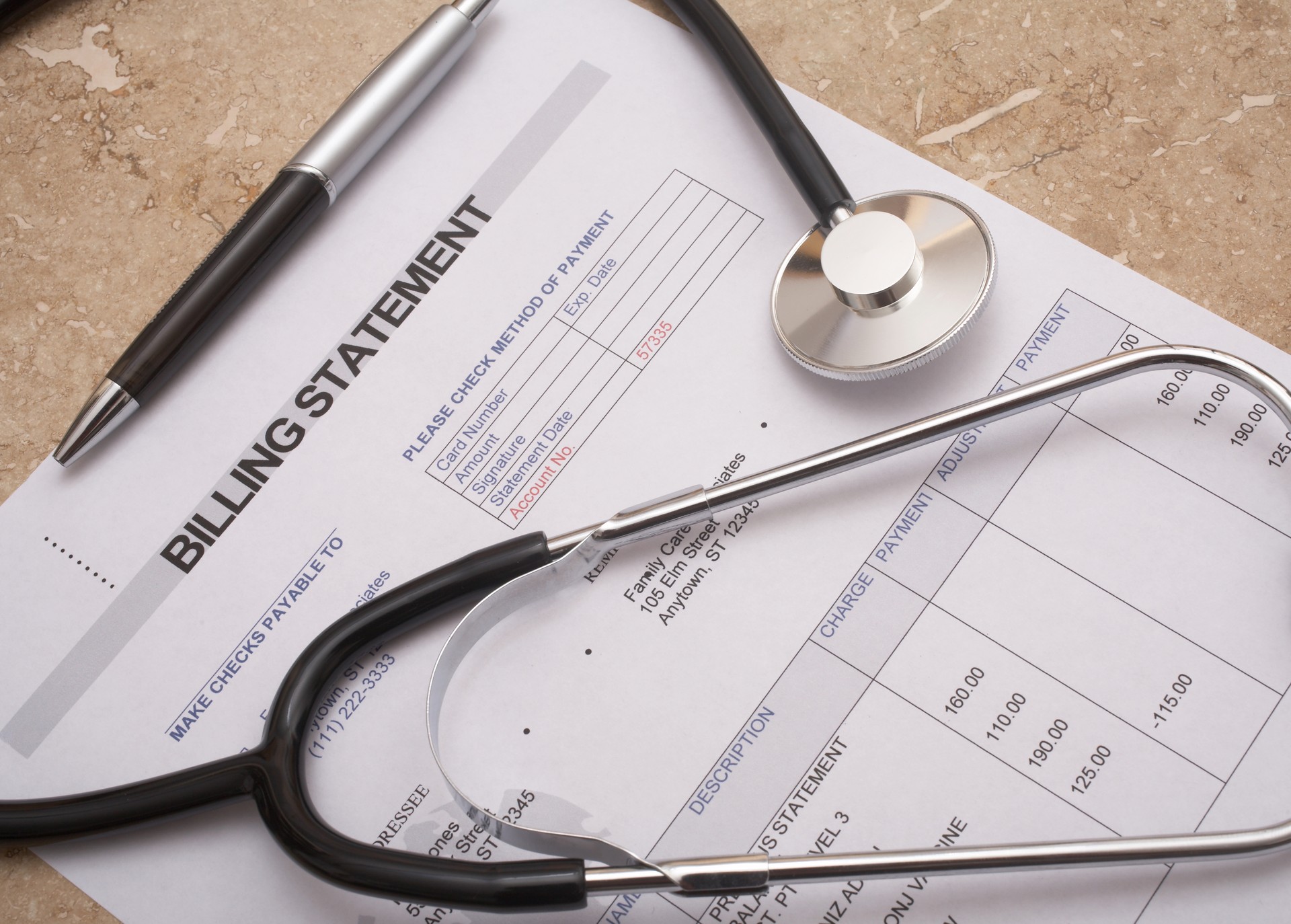 Stethoscope on medical bill statement